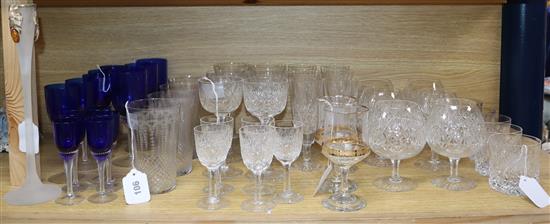 A collection of table glassware, including a part suite of cut crystal drinking glasses